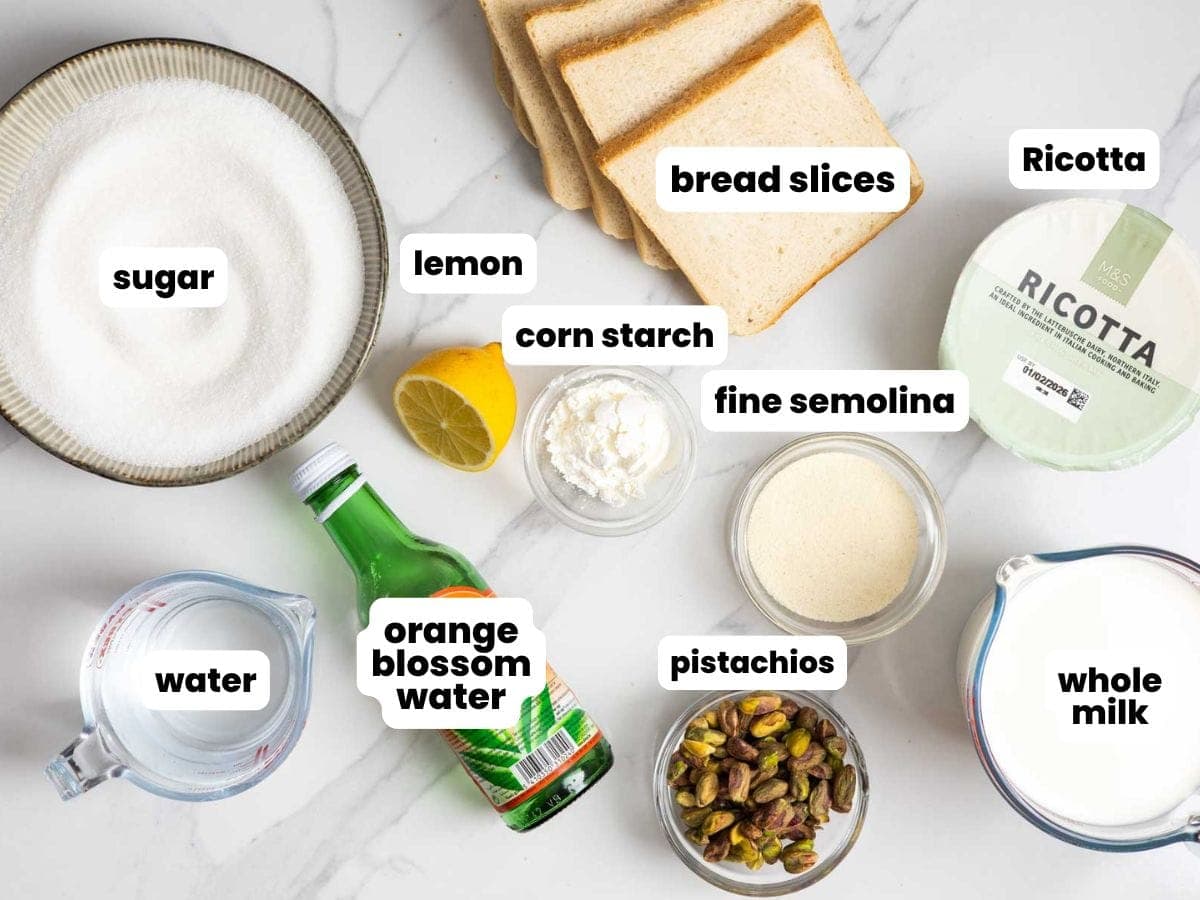 Ingredients needed to make Aish el saraya including sugar, bread slices, water, milk, ricotta, semolina, lemon, corn starch, orange blossom water, and pistachios