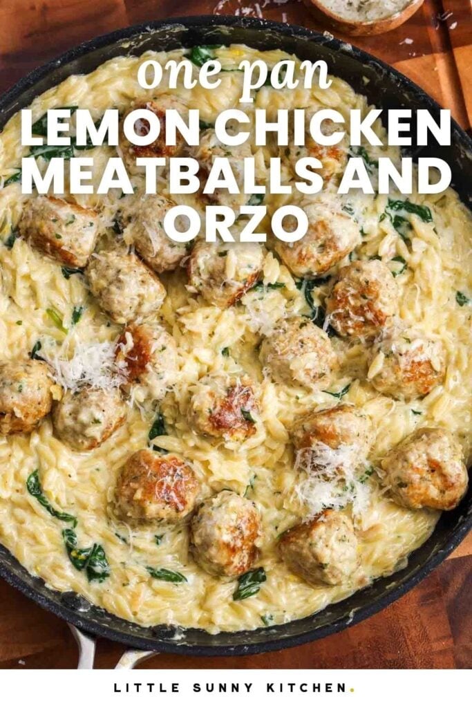 a frying pan of creamy orzo pasta with spinach and chicken meatballs, set on a wooden cutting board, garnished with parmesan cheese. Text overlay says "one pan lemon chicken meatballs and orzo.