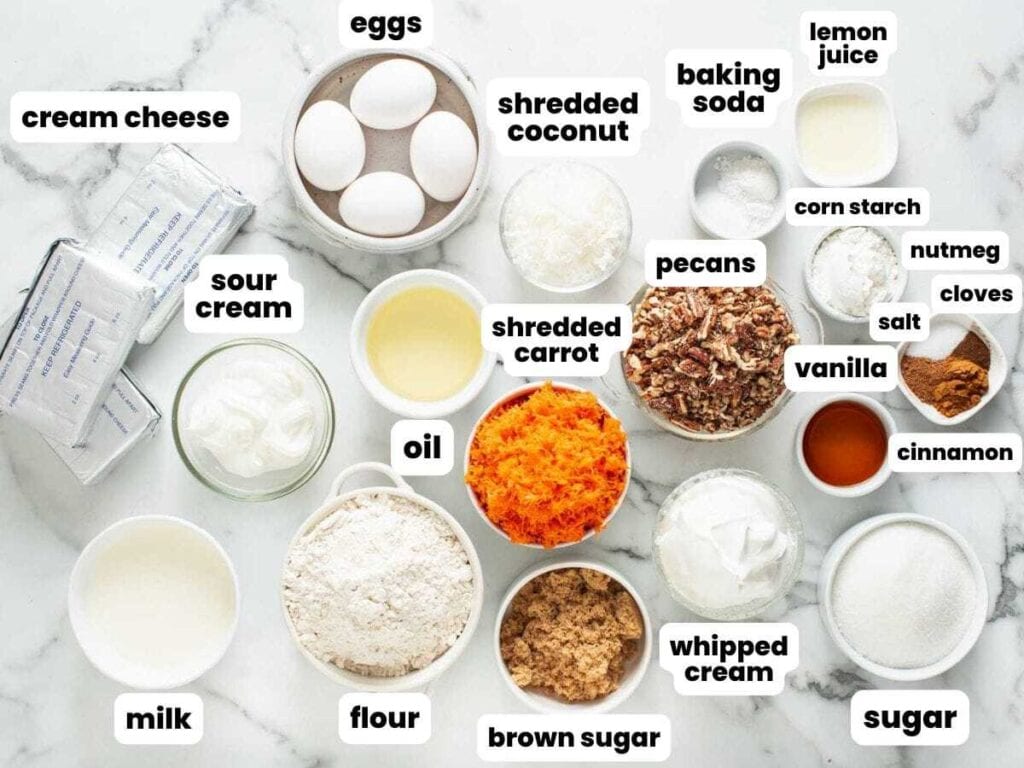 Ingredients measured into small bowls and arranged on a counter, for layered carrot cake cheesecake.