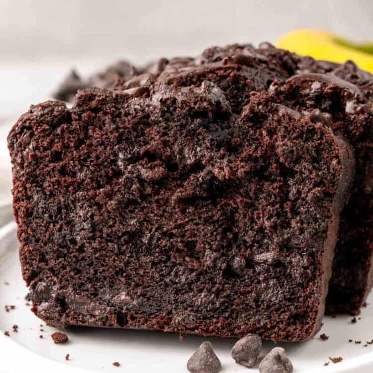 slices of double chocolate banana bread on a small white plate.