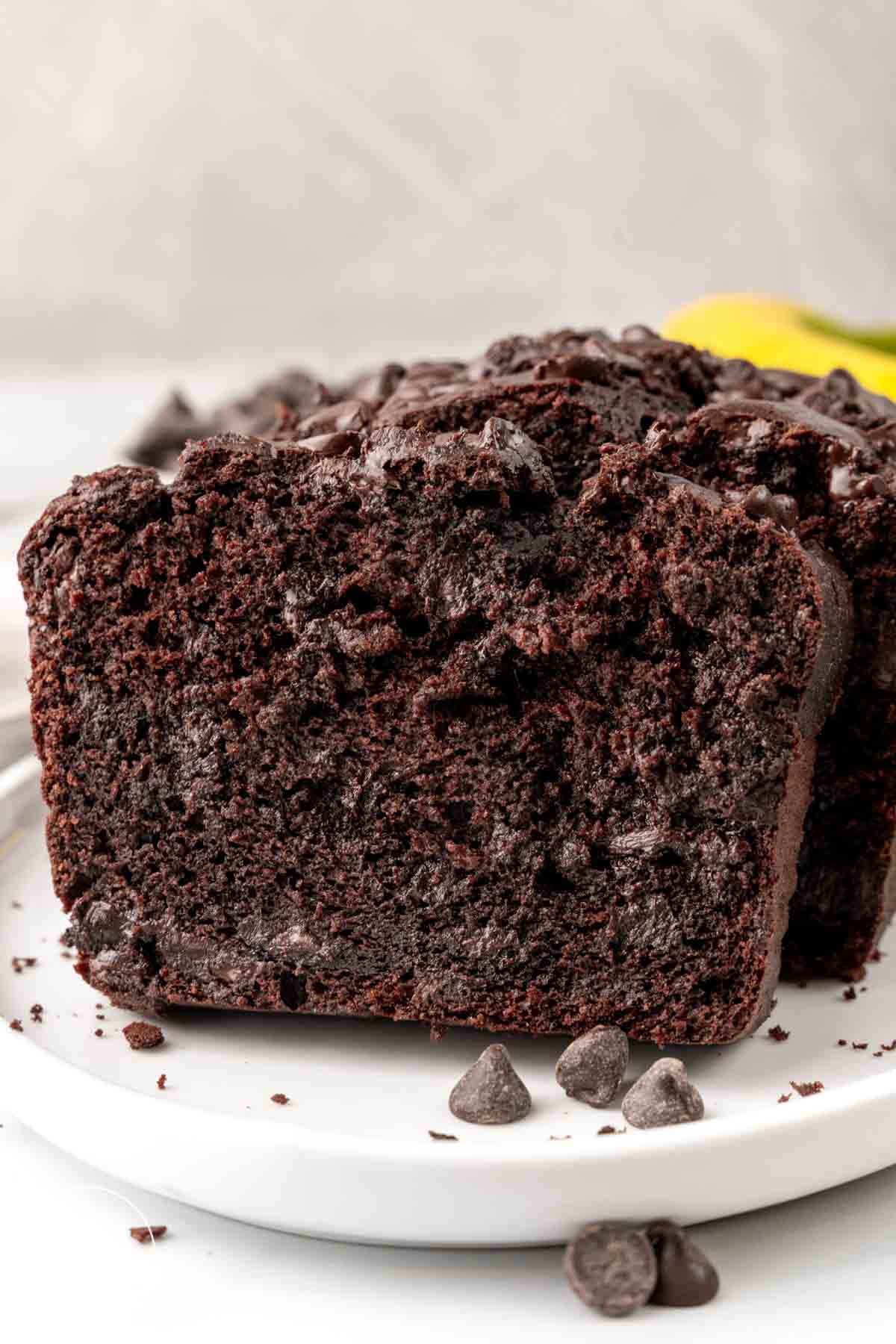slices of double chocolate banana bread on a small white plate.