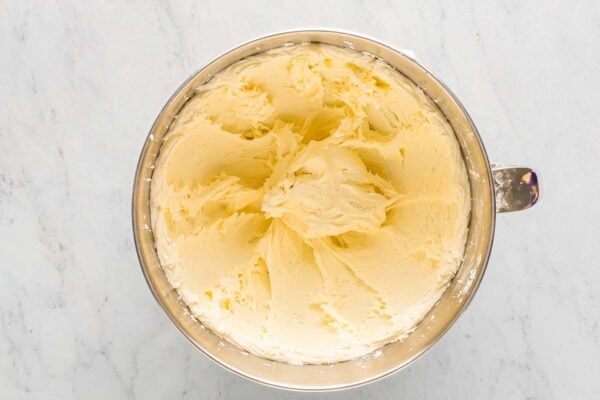 Whipped coconut frosting in a mixer bowl