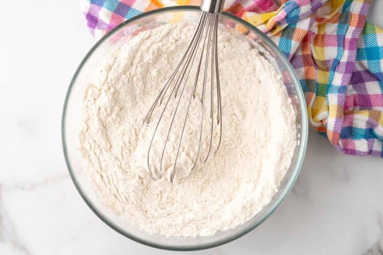 Flour whisked in a glass measuring bowl.