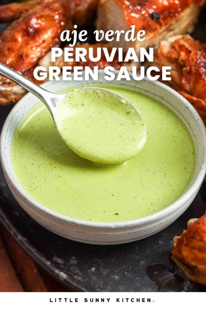 Peruvian green sauce (aji verde) in a bowl with roasted chicken