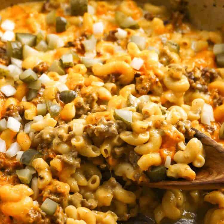Cheeseburger mac and cheese, finished with chopped dill pickles and chopped raw onion.