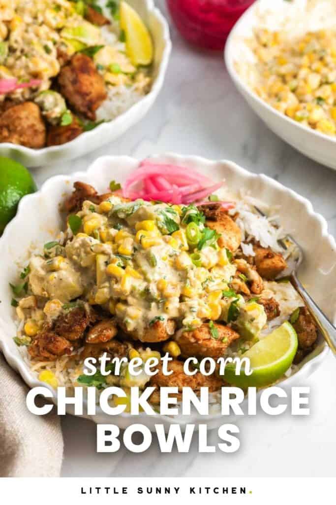 a rice bowl topped with chicken and creamy corn salad. Text overlay says "street corn chicken rice bowls"