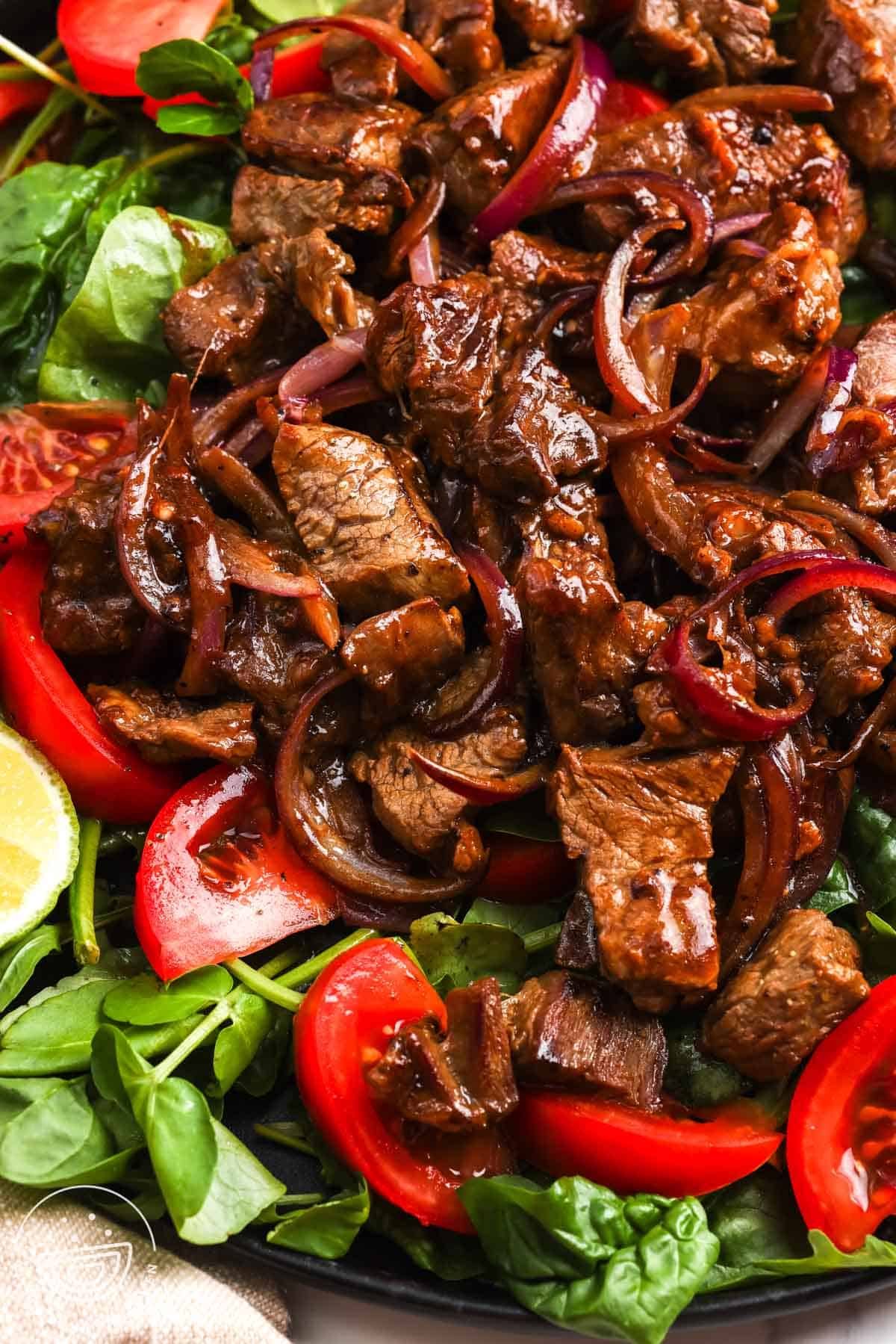 Browned beef and onions with salad