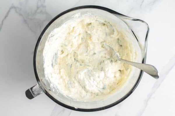Ricotta mixed with egg, mozzarella, and herbs to create a creamy texture.