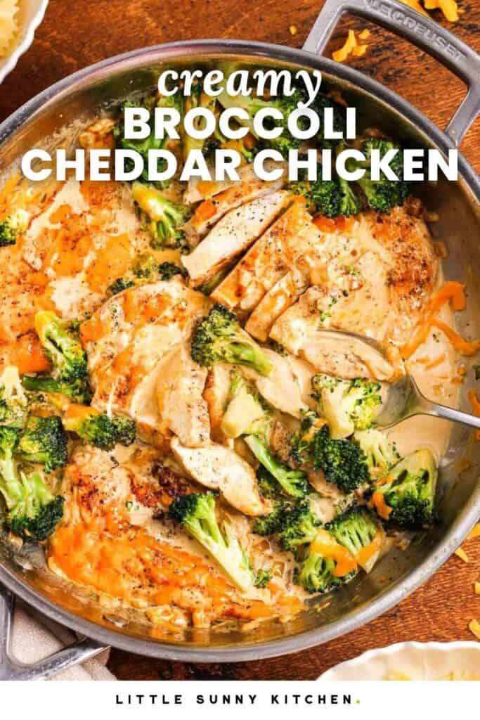 Sliced chicken in a skillet with a cheesy sauce and broccoli. Text overlay says "creamy broccoli cheddar chicken"