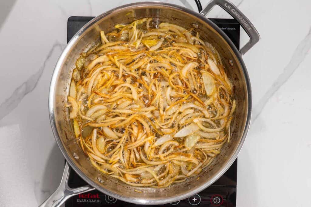onions frying in a skillet.