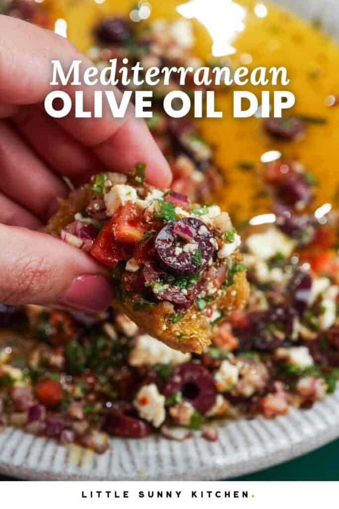 Pinterest graphic for Mediterranean olive oil dip showing crusty bread topped with olives, feta, tomatoes, and herbs.
