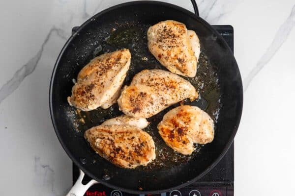 5 chicken breasts browned in a skillet