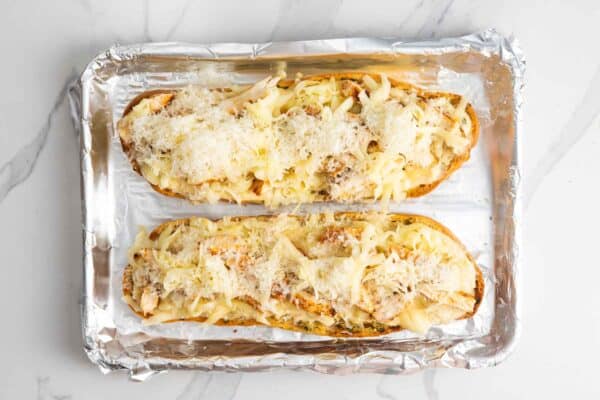 Chicken and mozzarella topped with grated Parmesan cheese before baking.