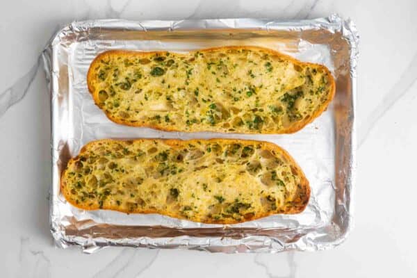 Garlic bread toasted until lightly golden on a foil lined baking sheet.