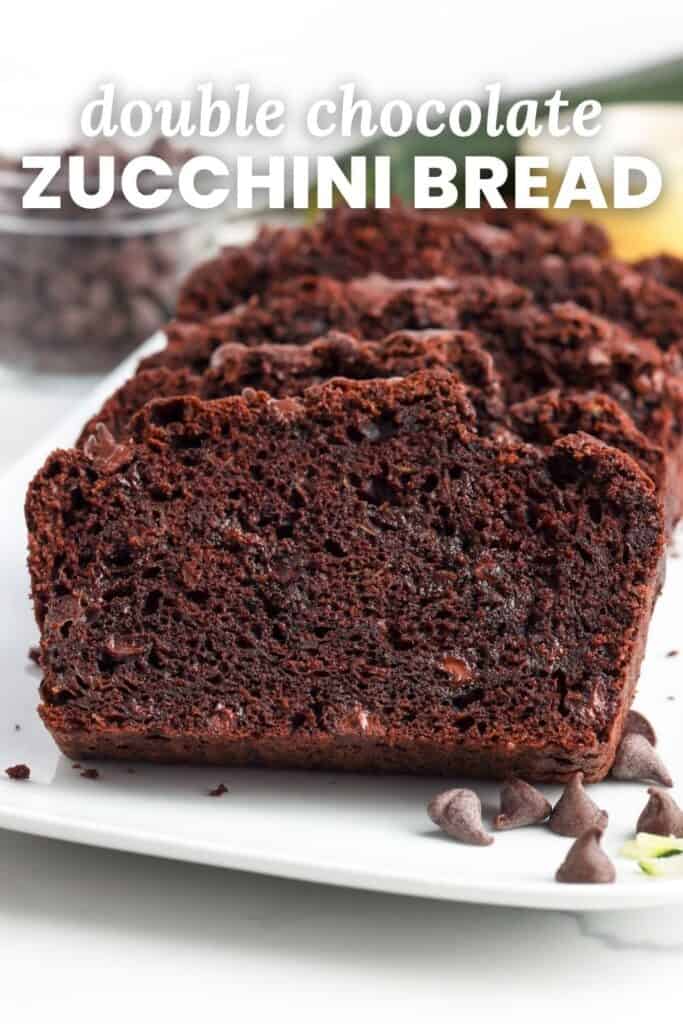 slices of chocolate bread on a platter. Text overlay says "double chocolate zucchini bread"