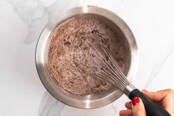 cocoa powder, flour, baking soda, baking powder, whisked together in a bowl.