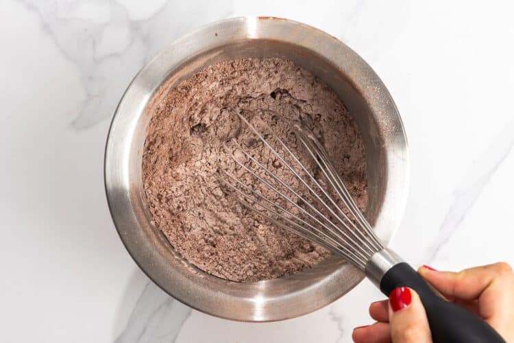 cocoa powder, flour, baking soda, baking powder, whisked together in a bowl.