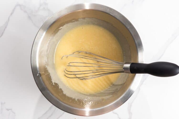oil, yogurt, eggs, whisked in a bowl.