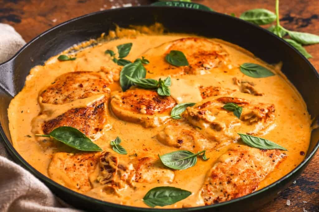 Pumpkin Marry Me Chicken with golden chicken cutlets in a creamy pumpkin, Parmesan, and sun-dried tomato sauce.