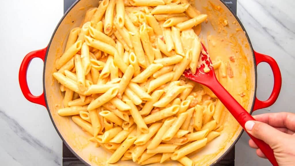 creamy cajun penne pasta in a large saucepan.