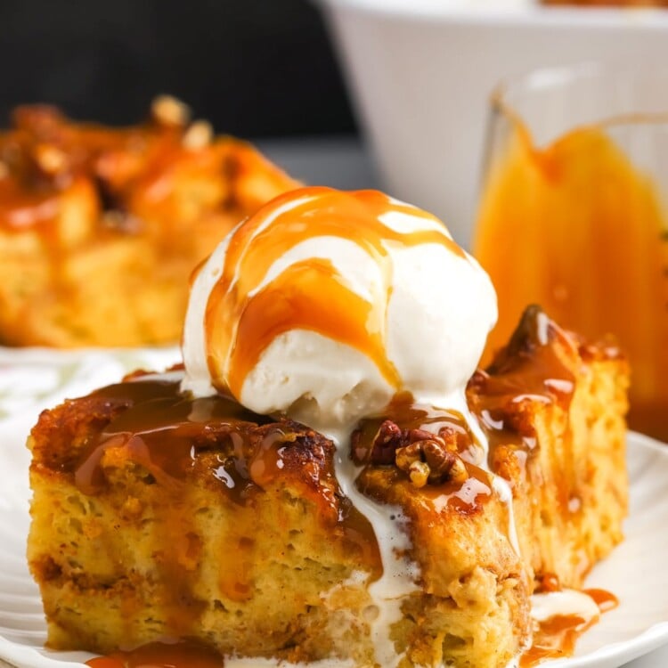 a slice of bread pudding made with pumpkin, topped with caramel and ice cream.
