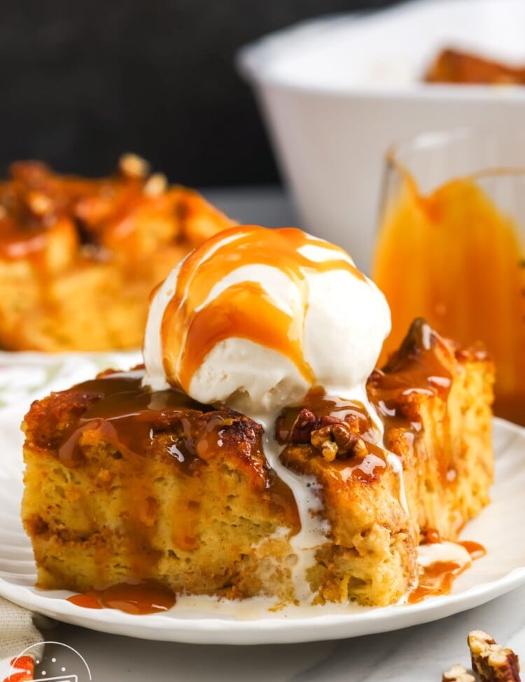 a slice of bread pudding made with pumpkin, topped with caramel and ice cream.
