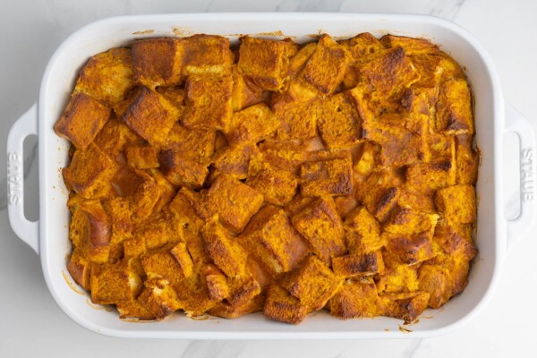 baked pumpkin bread pudding made with squares of brioche.