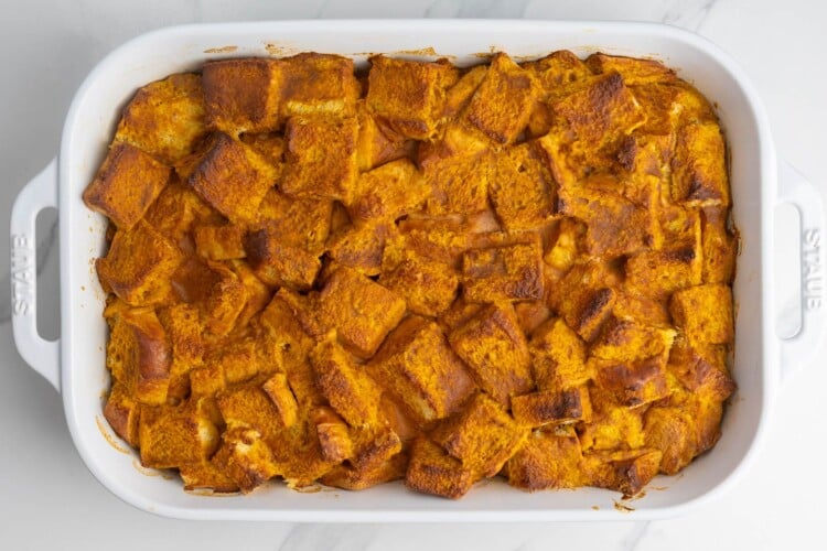 baked pumpkin bread pudding made with squares of brioche.