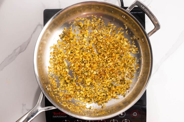 crispy sage breadcrumbs in a frying pan.