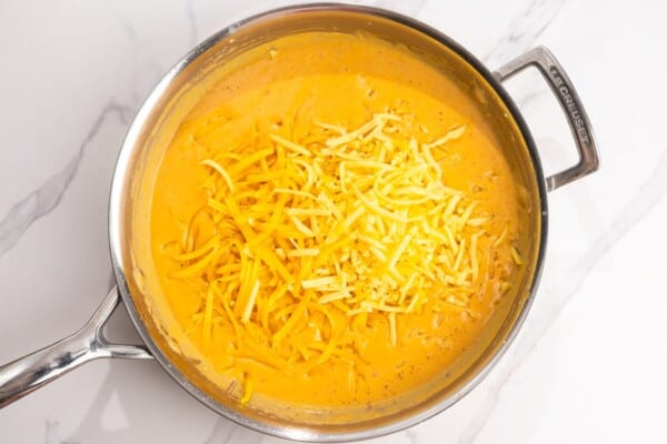 shredded cheddar cheese added to pumpkin sauce.
