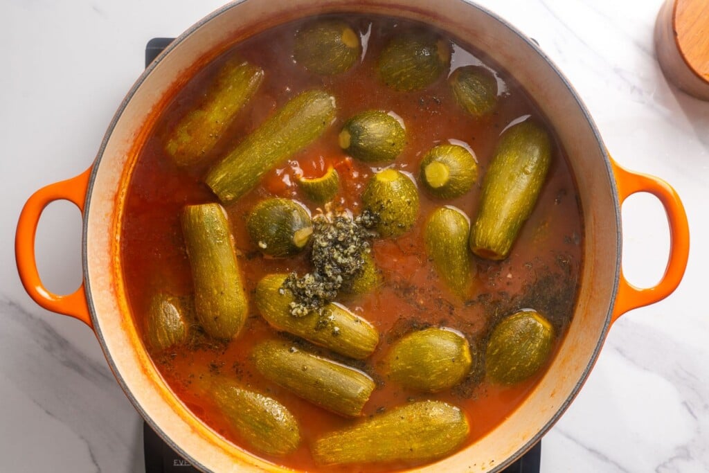 Garlic mint butter poured over the kousa in the pot.