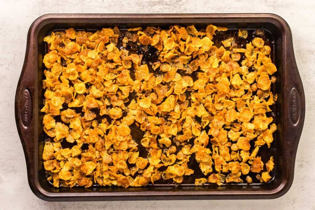 toasted cornflakes on a baking pan.