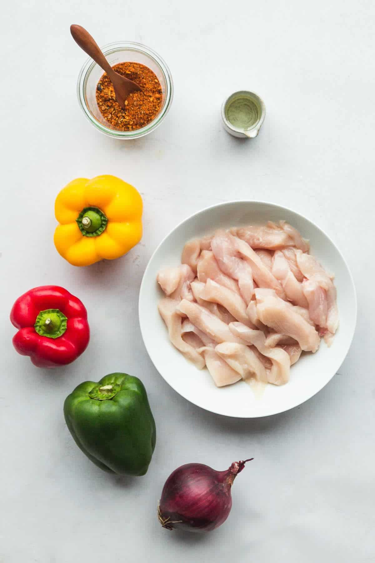 Ingredients needed to make chicken fajitas.