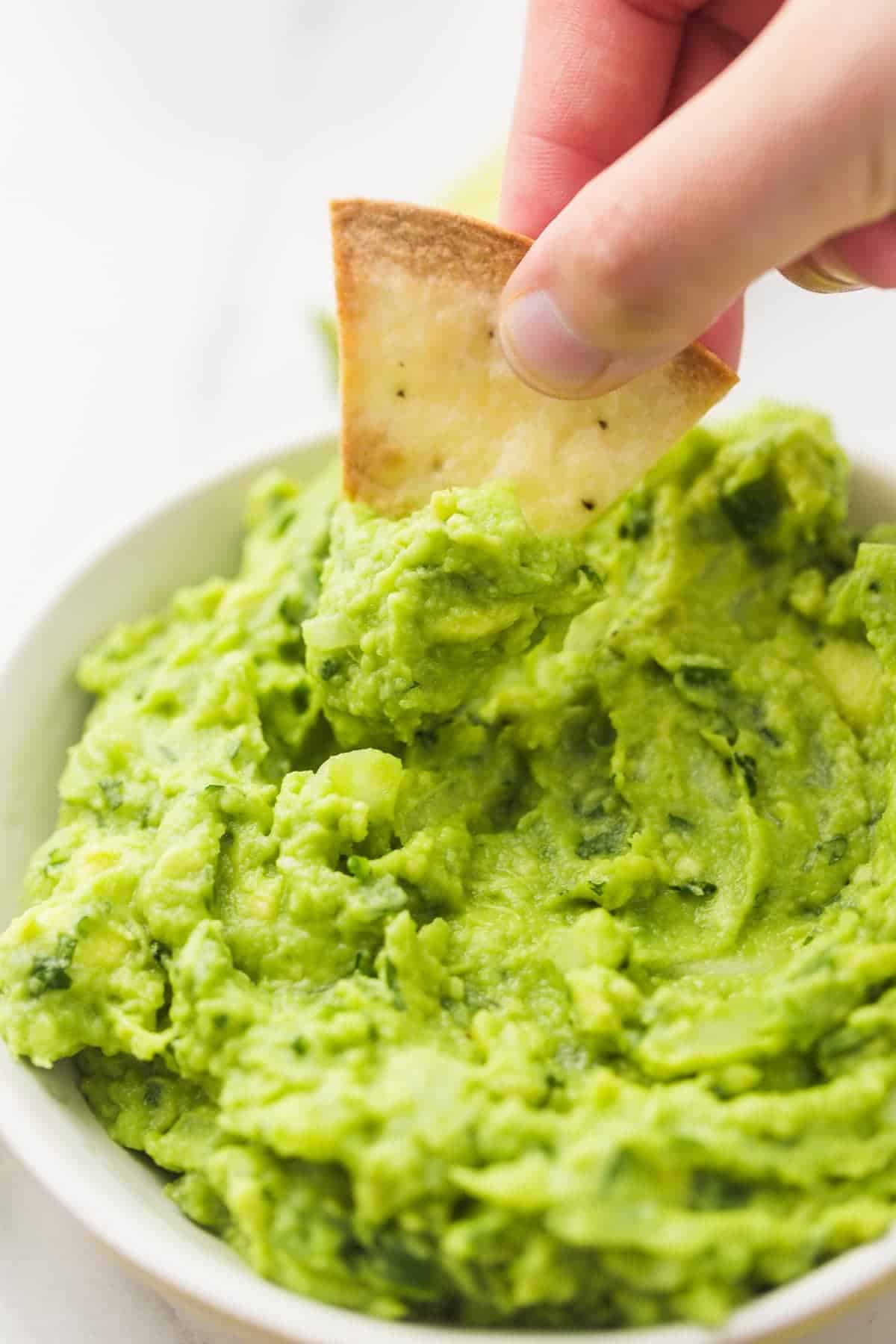 Eating guacamole with tortilla chips