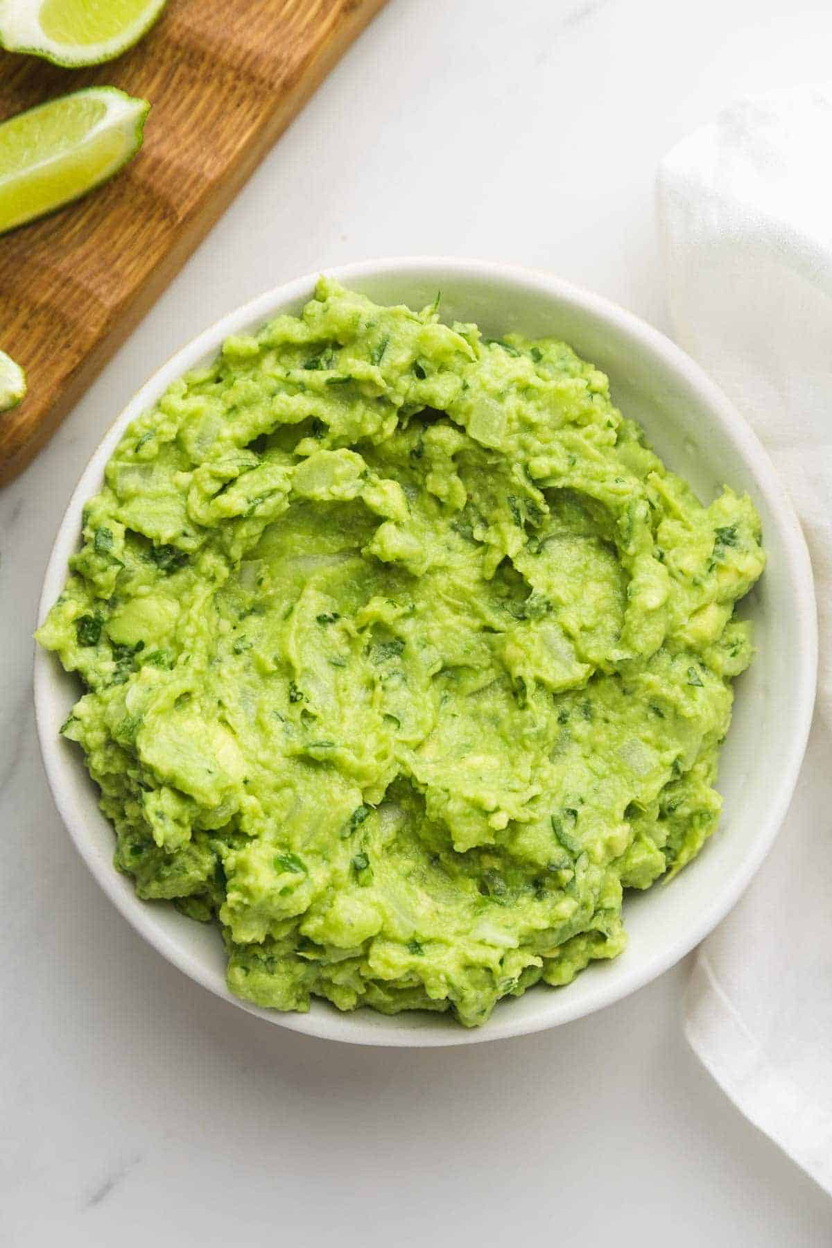 The best ever guacamole in a white bowl