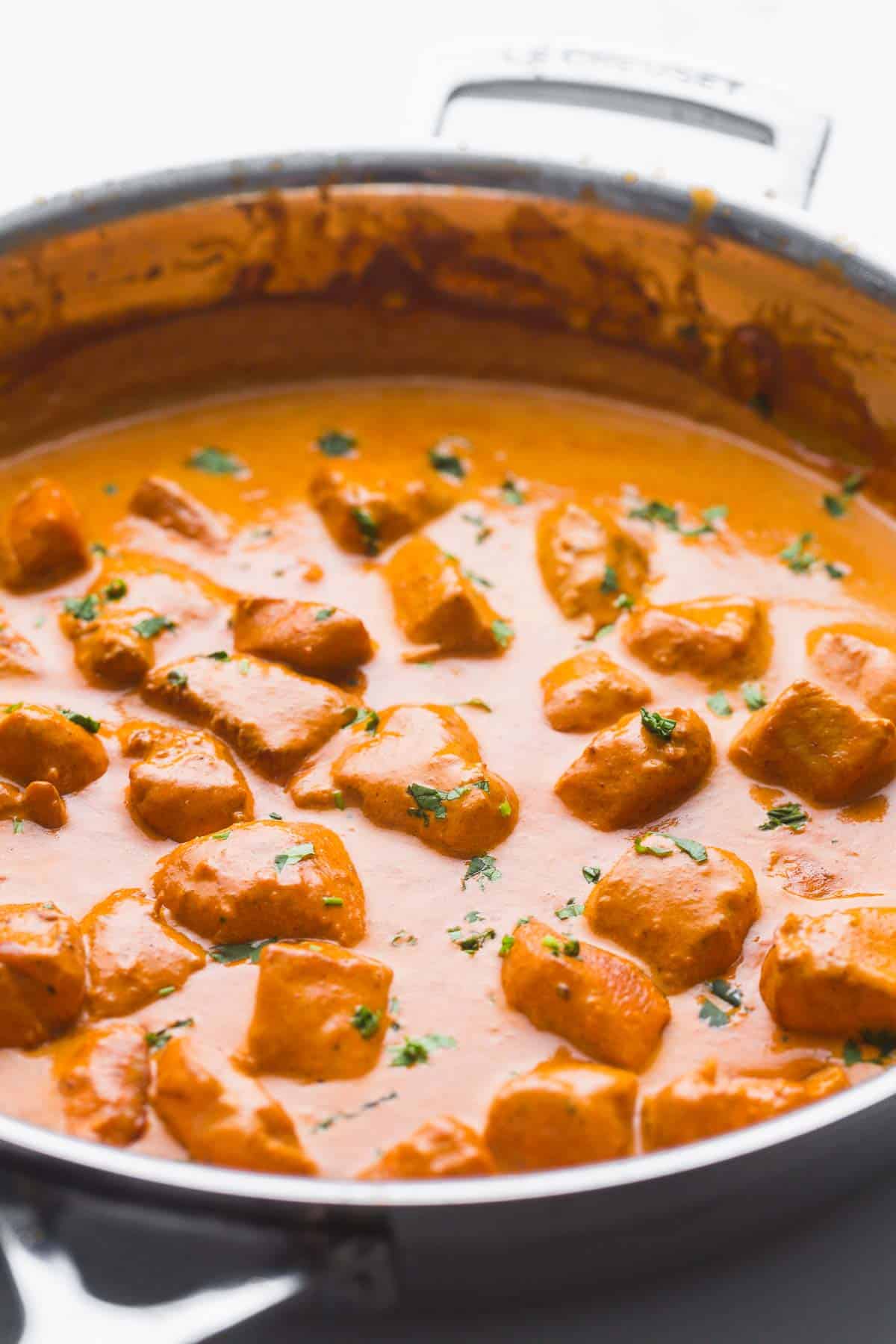 Butter chicken in a le creuset stainless steel pan