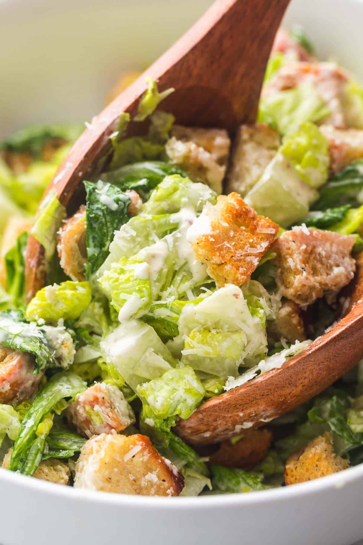 Caesar dressing in a Caesar salad and crunchy croutons