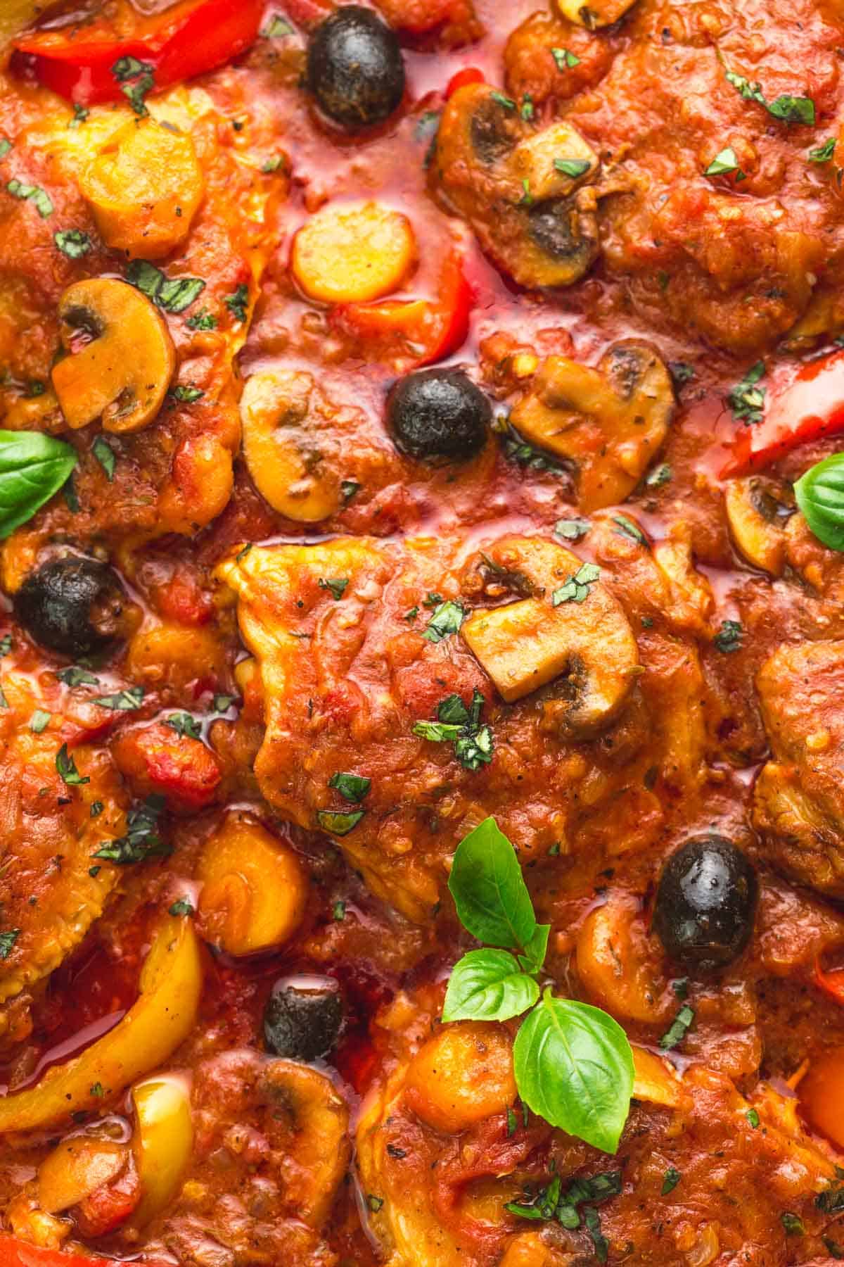 Close up of chicken cacciatore with mushrooms and olives