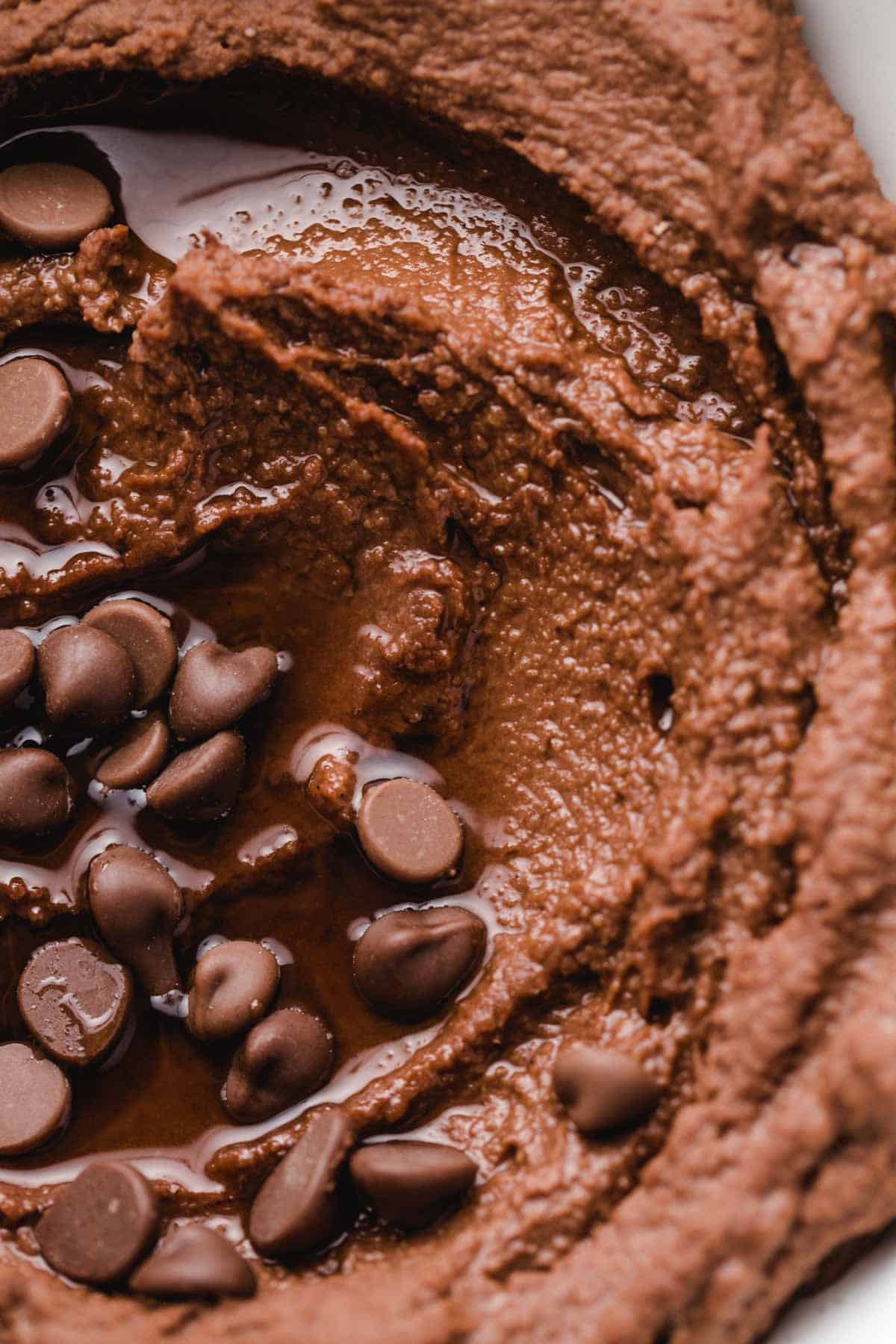 Close up of creamy chocolate hummus with chocolate chips