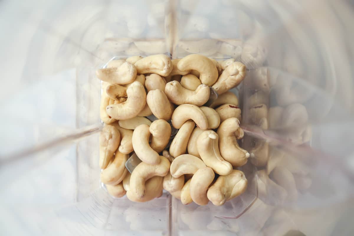 Soaked cashew nuts in a blender jug