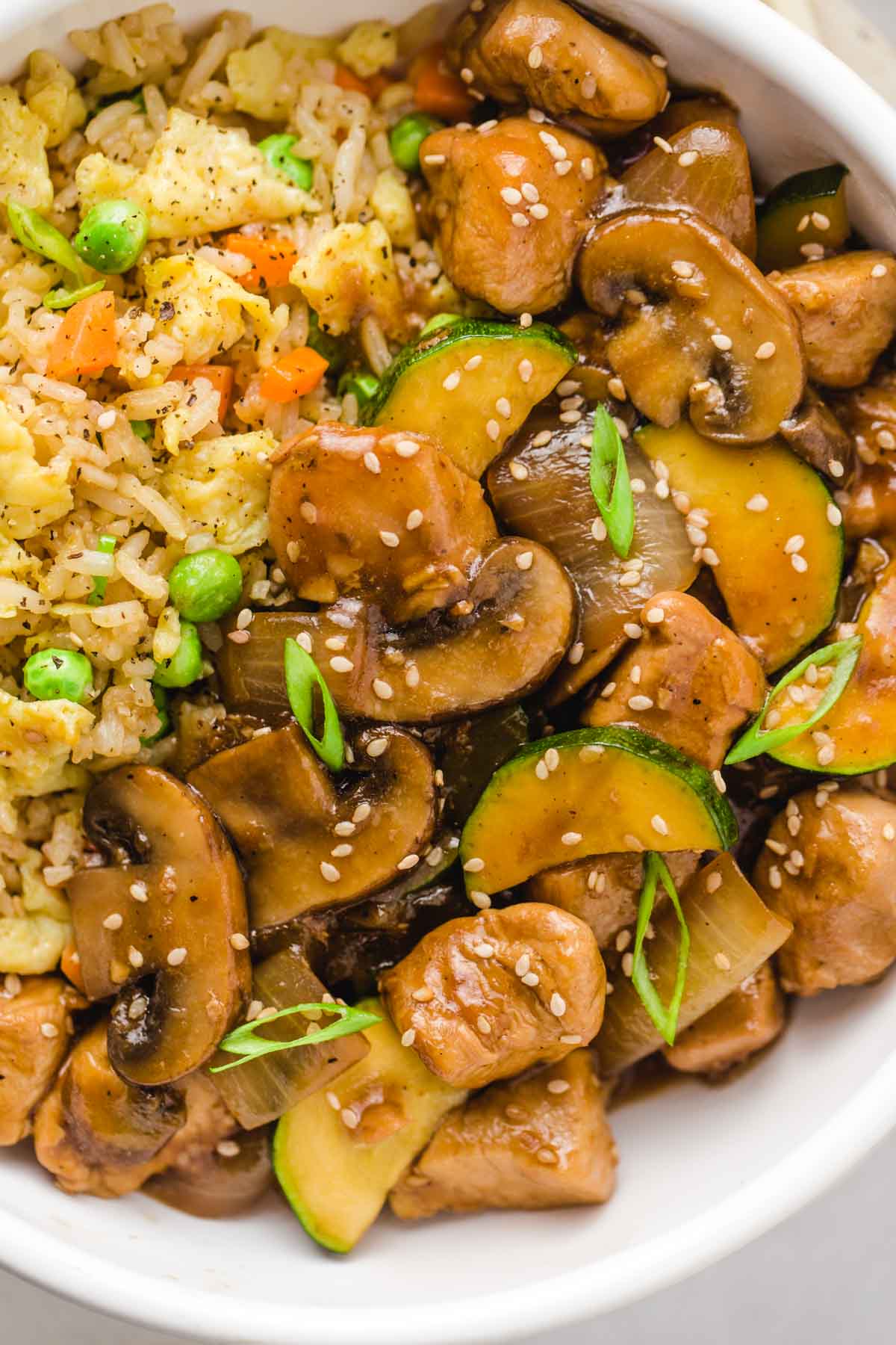 close up of hibachi chicken and hibachi rice in a bowl