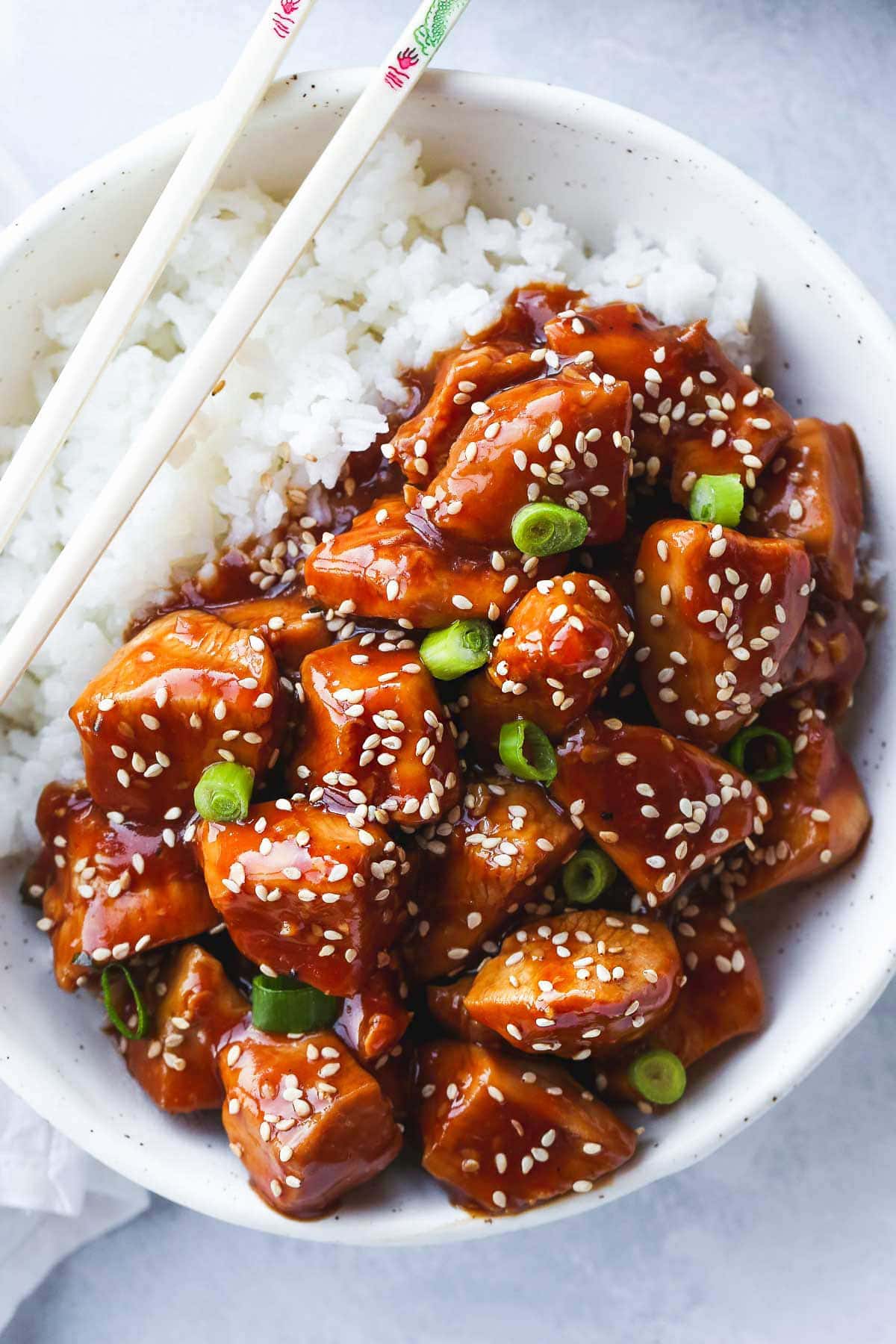 Instant Pot Sesame Chicken bowl with rice and chopsticks