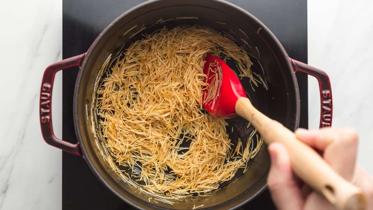 Toasting the vermicelli noodles in a Staub pot