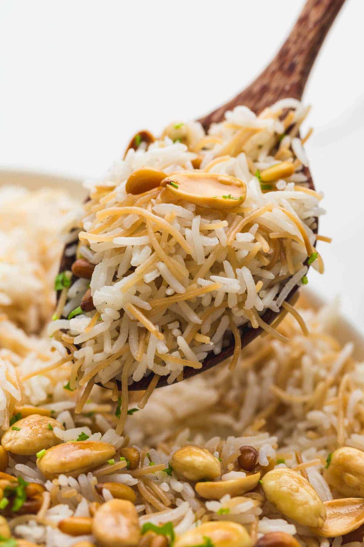 A close up shot of Lebanese Vermicelli rice on a wooden serving spoon