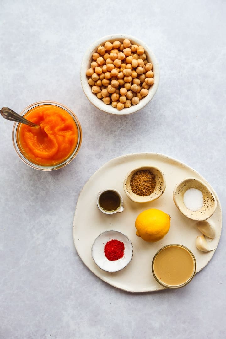 A flat lay with pumpkin hummus ingredients